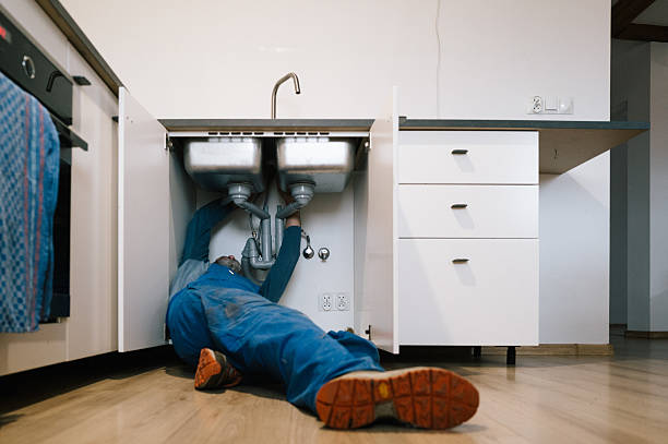 Professional Emergency Plumber technician working in Louisville, IL